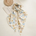 Detail of floral chiffon hair scarf scrunchie with blue and yellow patterns - Petal Yellow Streamer