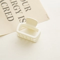 Detail of matte cream square hair claw clip on aesthetic minimalist background - Milk White