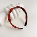 Dettaglio della trama del cerchietto in tessuto arancione con dentini antiscivolo - Torsione Arancione