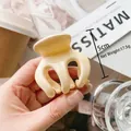 Minimalist cream yellow hair claw clip 5cm size held against a cozy artistic lifestyle backdrop - 5cm White
