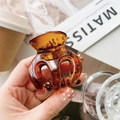 Detail showing high-quality amber translucent hair claw clip with glossy finish and strong teeth - 5cm Caramel