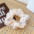 Sweet double-layer mesh scrunchie with colorful dots on a natural woven mat - Yellow