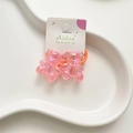 Pair of cute pink acrylic jelly bear hair ties with shimmering iridescent finish - Orange Bear