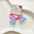 Set of two pink elastic hair ties featuring blue translucent gummy bear pendants - Blue Bear