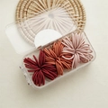 Pack of multi-color high elastic hair bands in red and pink with a clear storage box - 90 Pieces / Red Series