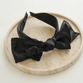 Close-up of elegant black satin headband with oversized bow on marble surface - Large / Black
