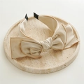 Close-up of elegant beige satin headband with large layered bow on marble tray - Large / Off White