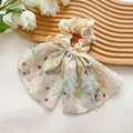 Eleganter cremefarbener Haargummi mit Schleife und gelben Blumen-Stickereien - Besticktes beiges Band