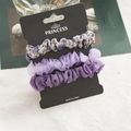 Set di 3 elastici per capelli viola con motivi floreali e tessuto in chiffon su cartoncino - Floreale Viola (FS3526)