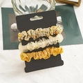 Set di 3 elastici per capelli floreali e gialli in chiffon plissettato su cartoncino - Floreale Giallo (FS3526)