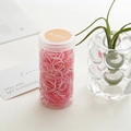Disposable pink elastic hair bands in a transparent jar for kids and women hairstyles - Pink Canister
