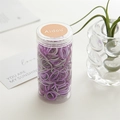Elastic hair band set in purple and grey colors within a clear cylindrical bottle - Purple Canister