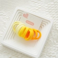 Set di elastici per capelli sfumati giallo e arancio con supporto in cartone - Gamma gialla