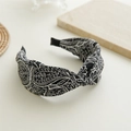 Detail of black and white paisley fabric headband with a stylish twisted knot design - Cross Border Black