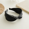 Detail of wide knotted headband with black and white ethnic paisley print on silk fabric - Double Fabric Border Black