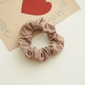 Detailed texture of dusty pink elastic scrunchie made of premium woven fabric material - Light Coffee