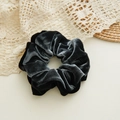 Detail of elegant black velvet hair scrunchie with soft texture on lace background - Gray And Black