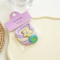 Detailed view of elastic hair ties in purple and beige with cartoon flower charms - Purple Series