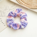 Detailed close-up of a tie-dye scrunchie with soft purple and pink knit fabric textures - Tie-Dye Purple