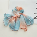 Detailed view of tie-dye chiffon scrunchie with long ribbons and pink stitched edges - Tie-dye Orange Blue