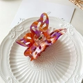 Detail of large butterfly hair claw with purple and orange gradient marble texture - Large Butterfly Orange