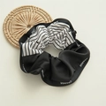 Detail of nautical style black and white silk scrunchie with Change letter print - Navy White Striped Scrunchie