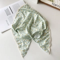 Detail of light green floral chiffon headscarf with cream crochet lace edges and yellow patterns - Green Floral