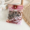 Detail of neutral brown elastic baby hair ties in transparent branded packaging - Style D