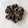 Close-up of brown satin scrunchie with black polka dots and soft texture detail - Dark Coffee Polka Dot Style