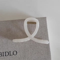 Elegant cream-colored matte shark hair claw clip with a minimalist twisted design - X Shape Style / Beige
