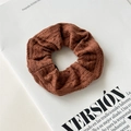 Deep brown knitted scrunchie with soft ribbed texture for stylish hair styling - Knitted Brown With Tag