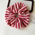 Detailed view of pink and beige striped knit scrunchie with soft ribbed wool texture - Dark Red Striped