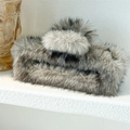 Detailed view of the oversized plush faux fur hair claw clip in a grey mottled pattern - 15cm Square Light Gray
