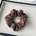 Detail of dark coffee vintage suede scrunchie with high elasticity pleats on a fabric tray - Retro Suede Coffee