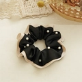 Detail of elegant black velvet hair scrunchie with cream ruffles and faux pearl beads - Beaded Style / Black
