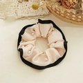 Detail of pink satin hair scrunchie with black trim and elegant pearl embellishments - Beaded Style / White