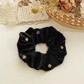 Detailed view of luxury black velvet hair scrunchie with sparkling silver rhinestones - Zirconia Inlaid / Black