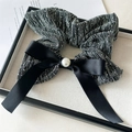 Detail shot of black scrunchie with silver silk texture, satin bow, and centered pearl bead - Square Scarf Grey Rhinestone Bow Style (FQ4242)