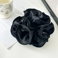 Detailed view of a large black satin scrunchie with ruffled edges and silky texture - Black Large Ruffle