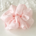 Detail of soft pink chiffon scrunchie with elegant ruffles and translucent texture - Soft Pink
