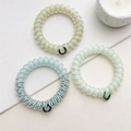 Lot de trois chouchous spirales élastiques aux couleurs pastel et motifs à pois - Série Bleue
