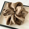 Macro detail of glossy brown satin scrunchie showing premium pleated fabric texture - Large / Light Coffee