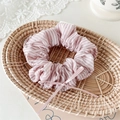Detail of pink striped scrunchie with rhinestones and ribbon bow in a woven basket - Hot-fix Rhinestone Pink