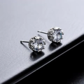 Silver stud earrings with round cubic zirconia in a six-prong crown setting - Water Ripple (X673-A)