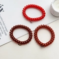 Set of 3 spiral telephone cord hair ties in vibrant red and amber brown shades - Red Series