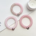 Three-piece set of pink spiral telephone wire hair ties with pearlescent finishes - Pink Series