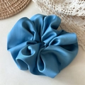 Detail of premium light blue satin scrunchie with glossy finish and ruched texture - Large / Blue