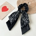 Detail of a floral black double-layered hair scrunchie with long ribbons and satin texture - Branch Pattern Double Layer / Black