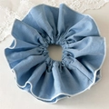 Detail of light blue fabric scrunchie featuring white overlock stitching and soft cotton texture - Extra Large Denim Blue Scrunchie