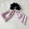 Detail of satin scrunchie with pink bow and black pleated fabric with silk texture - Pink Double Layer Satin